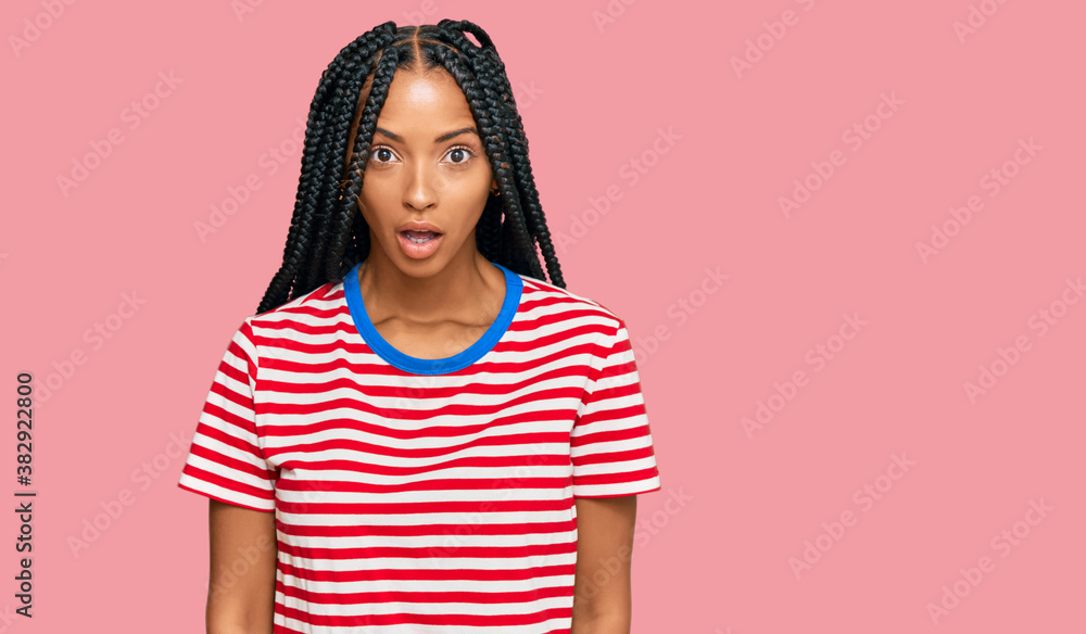 Beautiful hispanic woman wearing casual clothes afraid and shocked with surprise and amazed expression, fear and excited face. Beautiful hispanic woman wearing casual clothes afraid and shocked with surprise and amazed expression, fear and excited face.