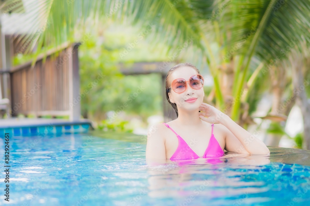 Portrait beautiful young asian woman smile relax around outdoor swimming pool in resort Portrait beautiful young asian woman smile relax around outdoor swimming pool in resort