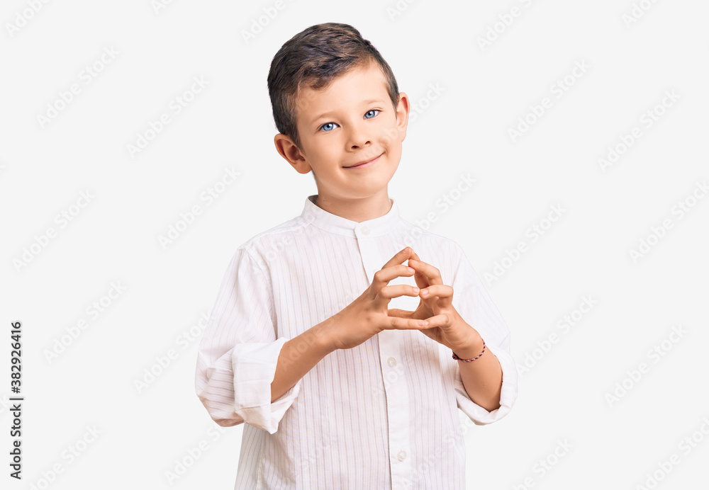 Cute blond kid wearing elegant shirt hands together and fingers crossed smiling relaxed and cheerful. success and optimistic Cute blond kid wearing elegant shirt hands together and fingers crossed smiling relaxed and cheerful. success and optimistic