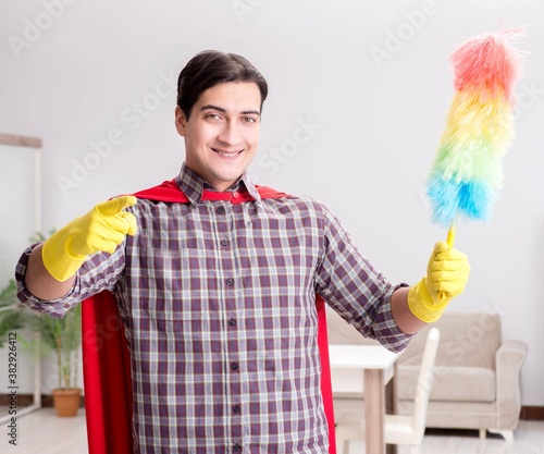 Bild auf Leinwand The the super hero cleaner doing housework