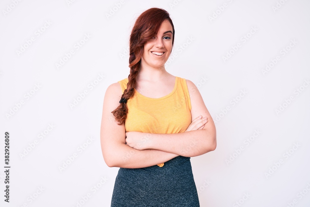 Young beautiful woman wearing casual clothes happy face smiling with crossed arms looking at the camera. positive person. Young beautiful woman wearing casual clothes happy face smiling with crossed arms looking at the camera. positive person.