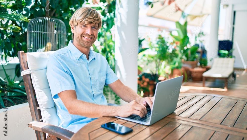 Middle age handsome man working at home using computer laptop Middle age handsome man working at home using computer laptop