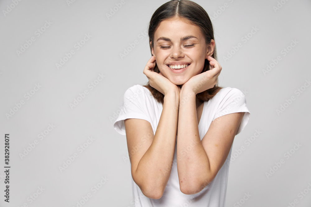 Cheerful woman smile closed eyes hands near face Cheerful woman smile closed eyes hands near face