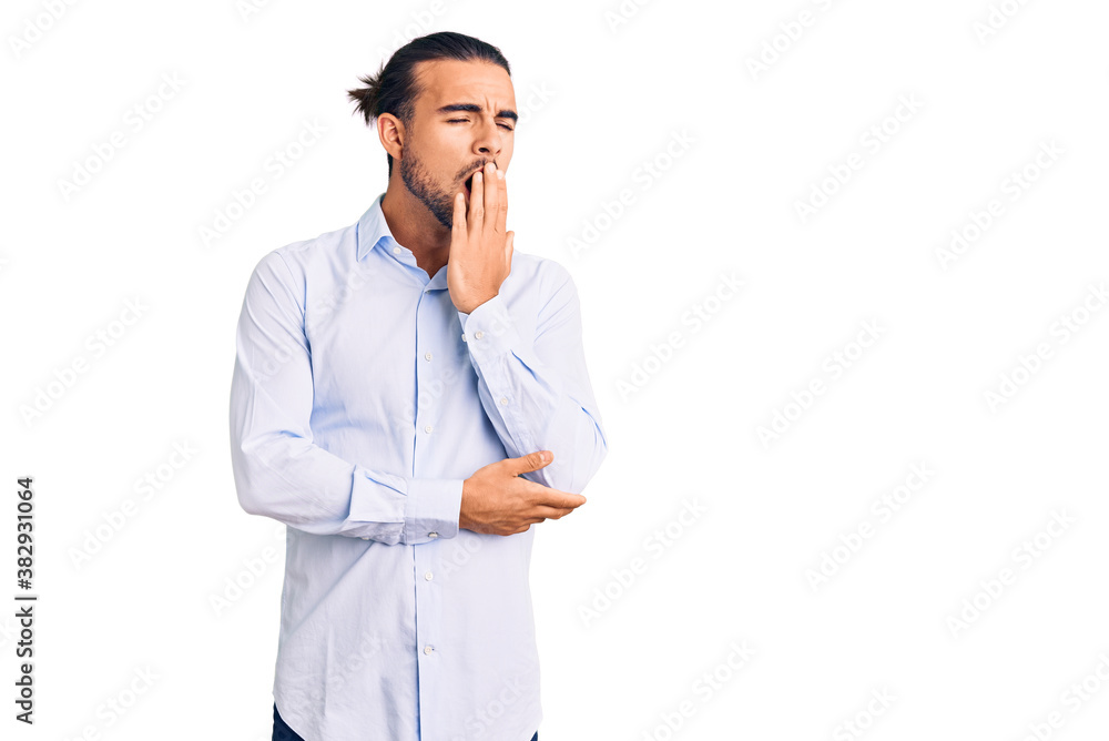 Young handsome man wearing business clothes bored yawning tired covering mouth with hand. restless and sleepiness. Young handsome man wearing business clothes bored yawning tired covering mouth with hand. restless and sleepiness.