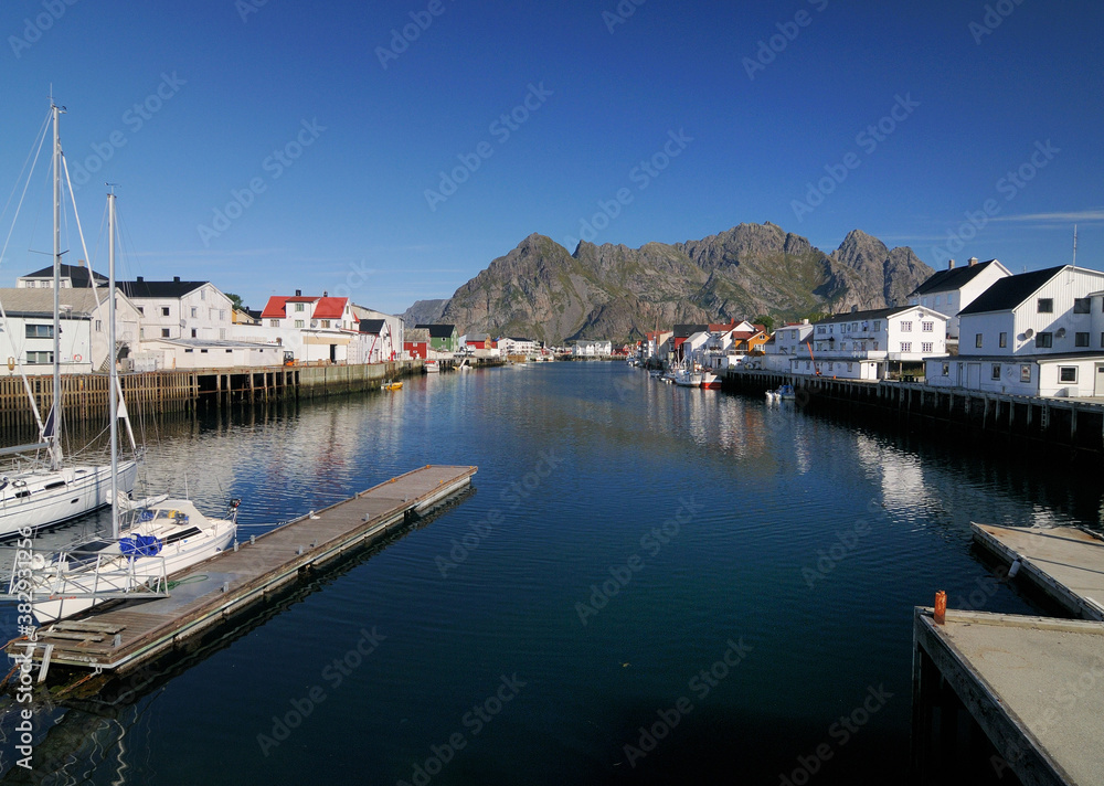 Harbour Of the Small Fishing Village Henningsvaer On Lofoten Island Austvagoy On A Sunny Summer Day With A Clear Blue Sky