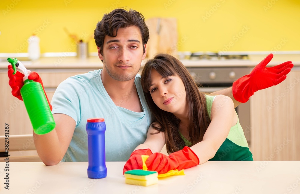 Young couple working at kitchen
