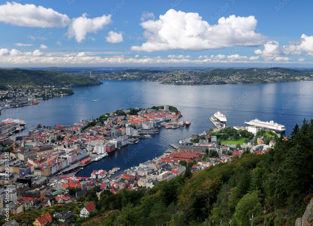 Spectacular View From Mount Floyen To The Harbour Of Bergen And The Byfjord On A Sunny Summer Day With A Clear Blue Sky And A Few Clouds