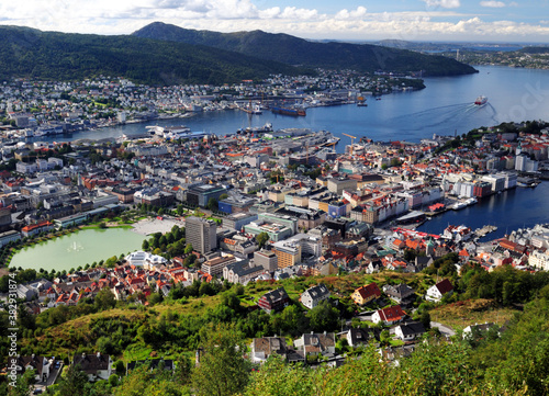 Spectacular View From Mount Floyen To Downtown And The Harbour Of Bergen On A Sunny Summer Day With A Clear Blue Sky And A Few Clouds © Joerg