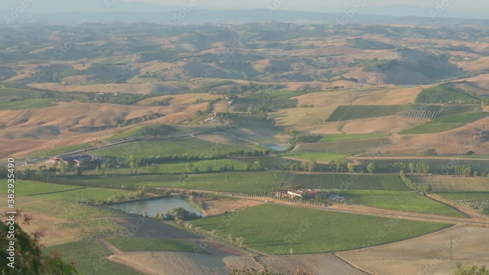 Tuscany, Italy. August. Aerial view of the amazing landscape of the Tuscan countryside in the evening, concept of freedom and escape from home life after the blockade of the coronavirus pandemic. Tuscany, Italy. August. Aerial view of the amazing landscape of the Tuscan countryside in the evening, concept of freedom and escape from home life after the blockade of the coronavirus pandemic.