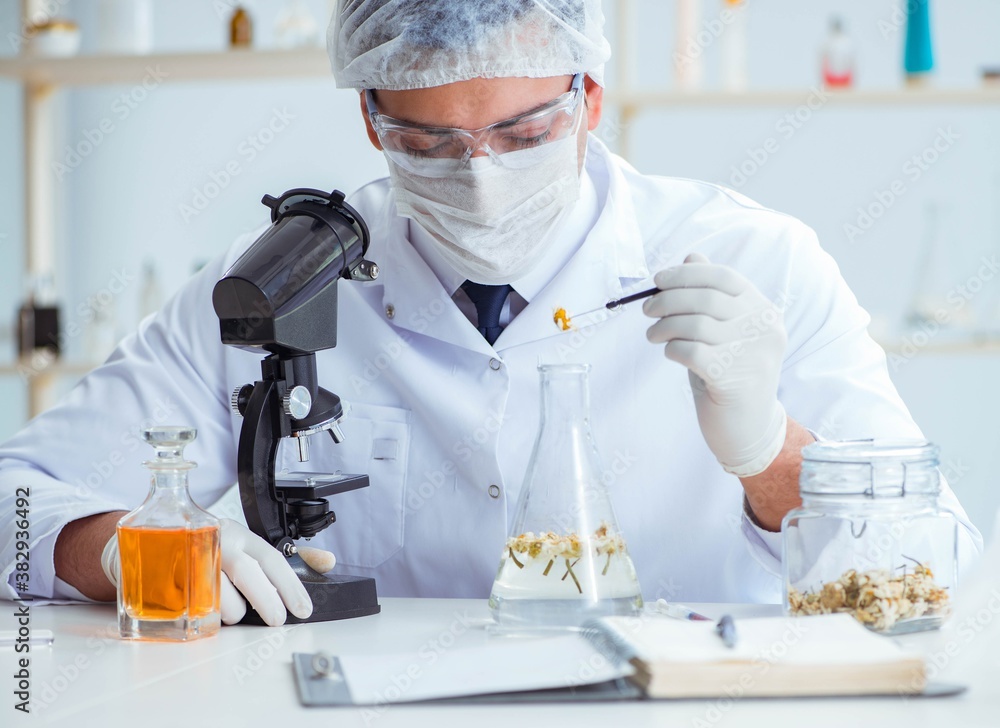 Fototapeta premium Chemist mixing perfumes in the lab