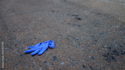 Disposable Glove Discarded on Sidewalk