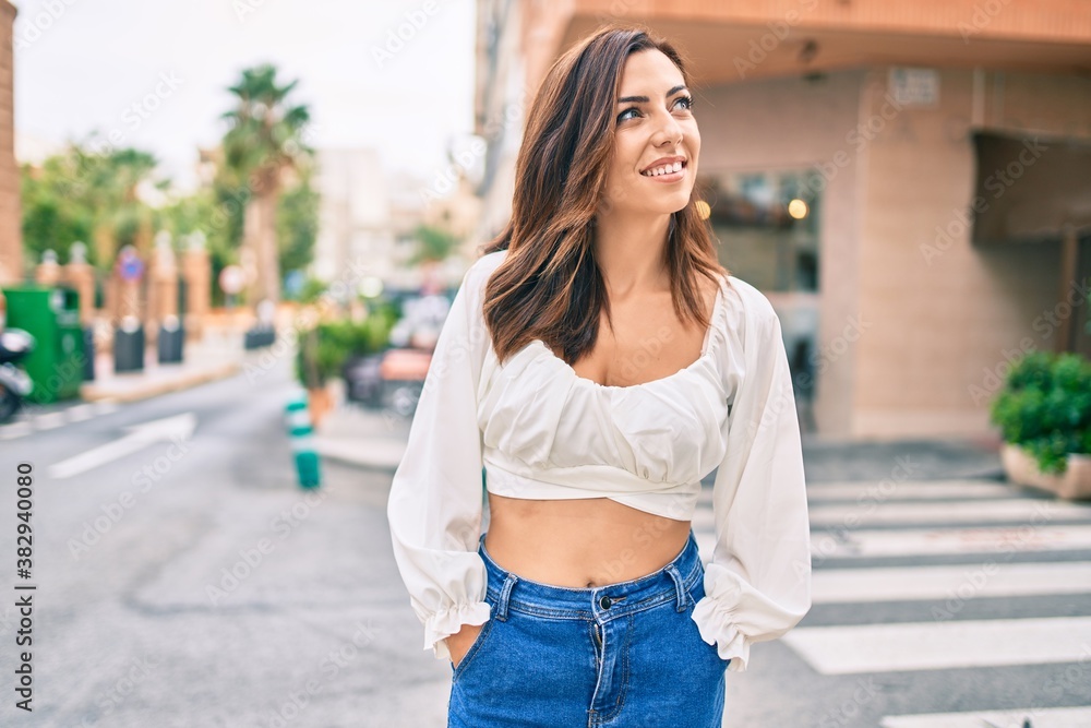 Young hispanic woman smiling happy walking at the city. Young hispanic woman smiling happy walking at the city.