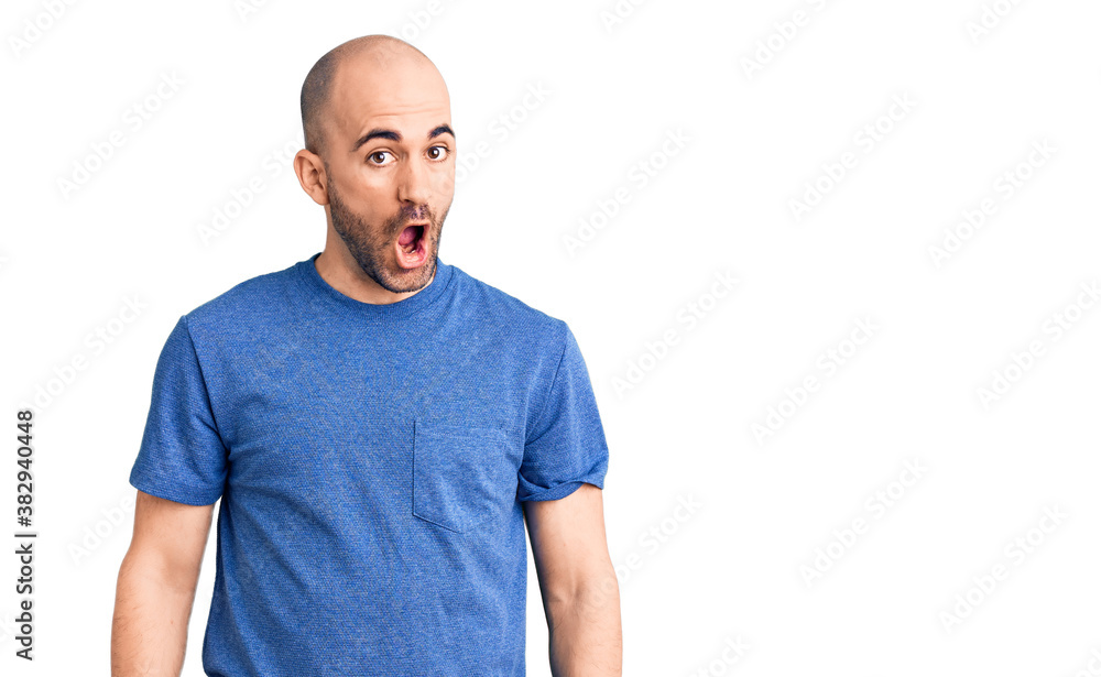 Young handsome man wearing casual t shirt afraid and shocked with surprise expression, fear and excited face. Young handsome man wearing casual t shirt afraid and shocked with surprise expression, fear and excited face.