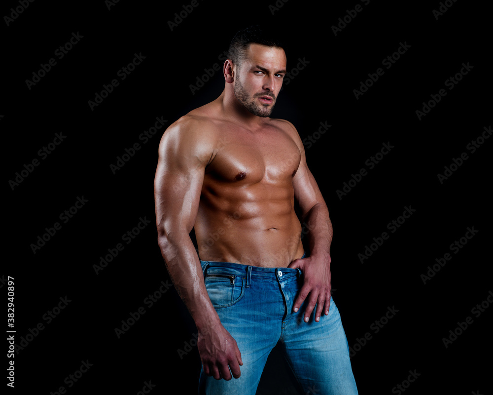 Sexy man with muscular body and bare torso on black. Sexy man with muscular body and bare torso on black.