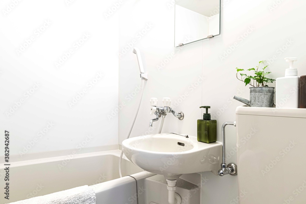 Small bathtub and shower in the bathroom at the hotel. Small bathtub and shower in the bathroom at the hotel.