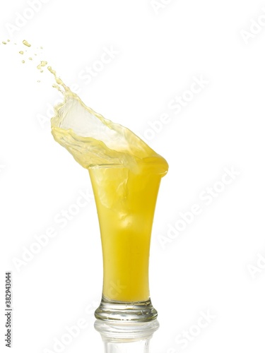 splashing orange juice with oranges isolated on white