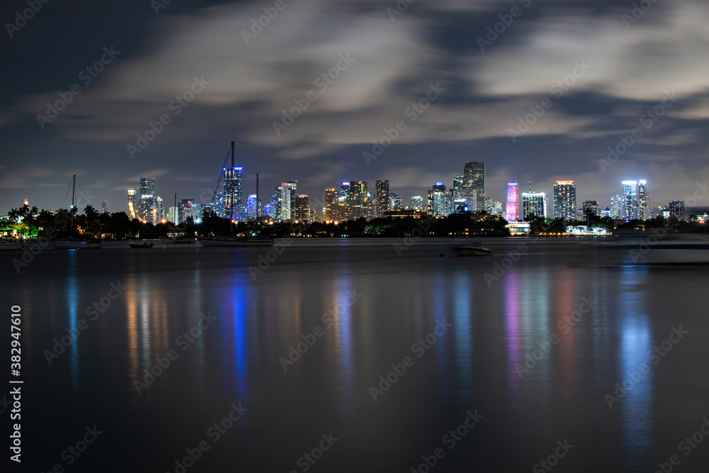 Miami, Florida, USA skyline on Biscayne Bay, city night backgrounds. Panoramic view of Miami skyline and coastline, Florida.