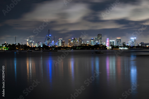 Miami, Florida, USA skyline on Biscayne Bay, city night backgrounds. Panoramic view of Miami skyline and coastline, Florida.