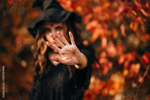 Close-up face of woman wearing witch hat on head for halloween