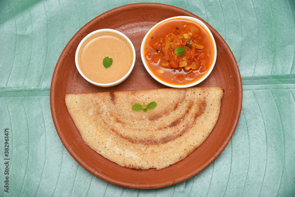 Dosa, ghee roast, coconut chutney and sambar popular South Indian
