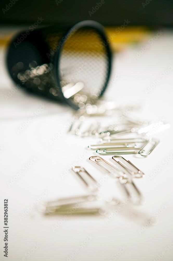 paper clips spilled from pencil box paper clips spilled from pencil box