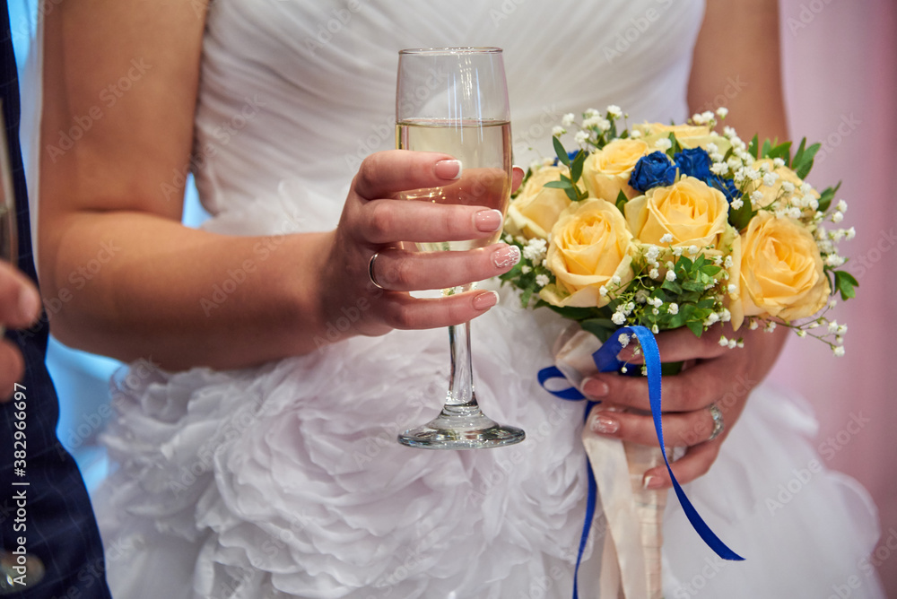 Bride and groom on their wedding day with glasses of champagne. Bride and groom on their wedding day with glasses of champagne.