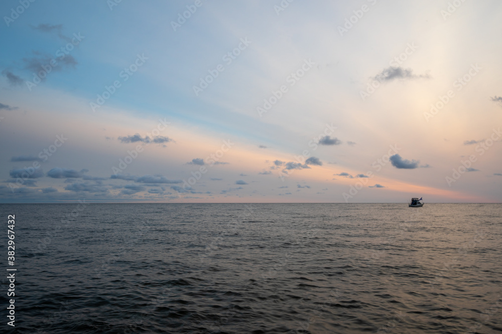 Fototapeta premium Beautiful sky at sunset at Grant Heaven Lake Michigan.