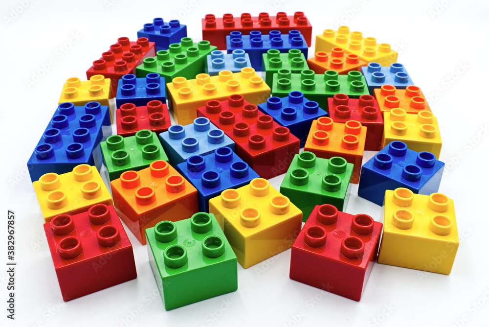 Obraz premium Colored plastic building blocks isolated on white background