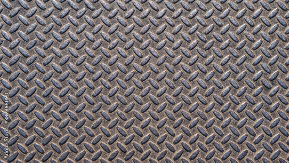 A metal plate with a seamless repeating pattern. Abstract metallic background. An interesting steel pattern for your projects. A metal plate with a seamless repeating pattern. Abstract metallic background. An interesting steel pattern for your projects.