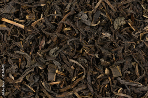 Dried tea leaves background texture. close-up