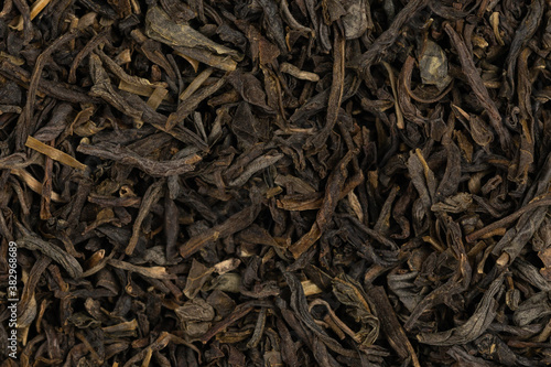 Photos Dried tea leaves background texture. close-up
