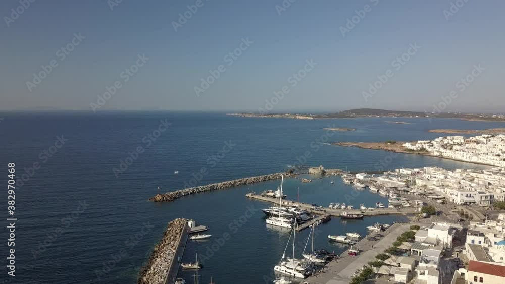 Aerial view of the pier with Paros island on a background Naousa village Aerial view of the pier with Paros island on a background Naousa village