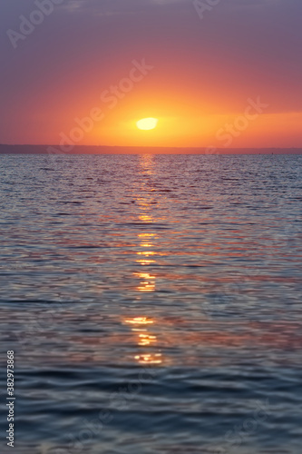 photo of early sunrise   calm sea reservoirs of Ukraine