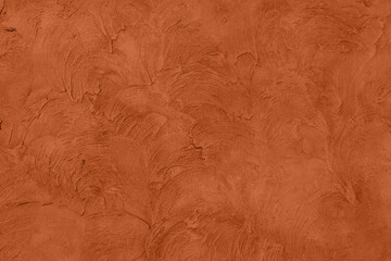 Saturated dark orange brown colored low contrast Concrete textured background with roughness and irregularities. 2021, 2022 color trend.
