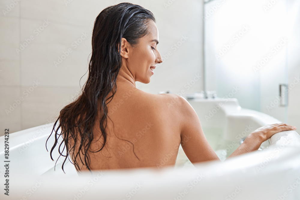 Beautiful young woman taking bath at home Beautiful young woman taking bath at home