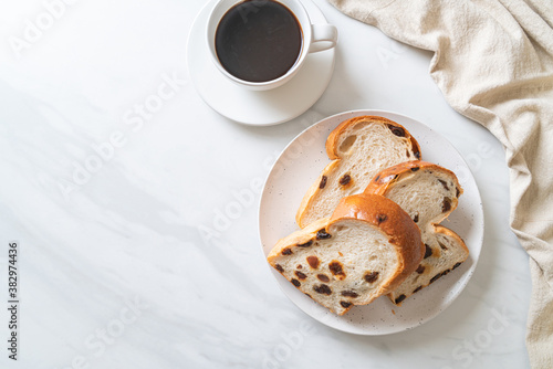 raisin bread with coffee cup photo