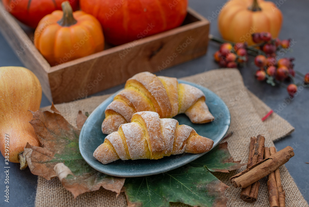 Sweet home made pumpkin crescent rolls on a table