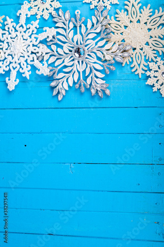 Christmas. Snowflakes on a wooden background.