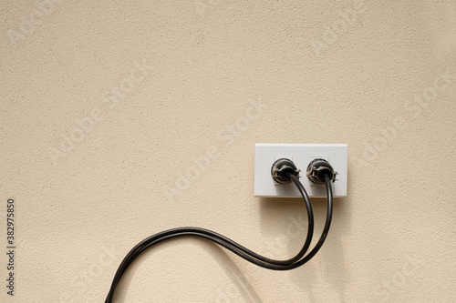 Electric wire plug Receptacle on the concrete wall background