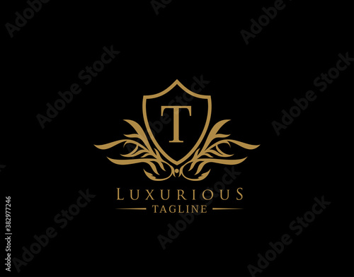 Classic Shield Logo With T Letter. Elegant Shield badge With Floral Shape perfect for fashion, Boutique, Jewelry, Hotel, Restaurant.