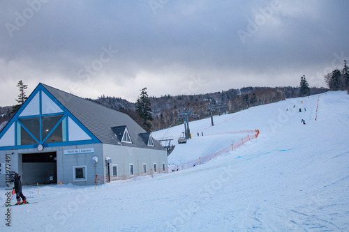 Skiers and Snowboarders in Area of Kiroro ski resort, Hokkaido, Japan. Kiroro Ski Resort is a beautiful place to ski in Japan.