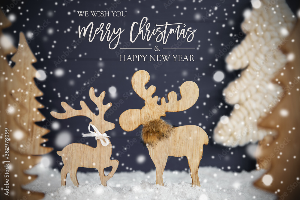 Fototapeta premium English Calligraphy Merry Christmas And A Happy New Year. Moose Couple In Love With Black Wooden Background. Christmas Trees With Snow And Snowflakes