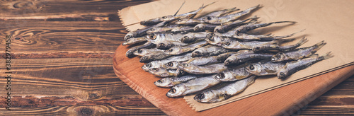 Photography Dried fish on a wooden background. Studio photo.