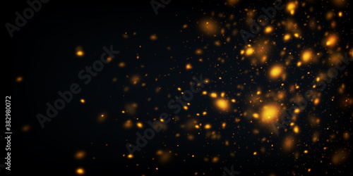 Vector abstract background with glowing golden particles. Defocused glitter effect. Sparkling lights on black.