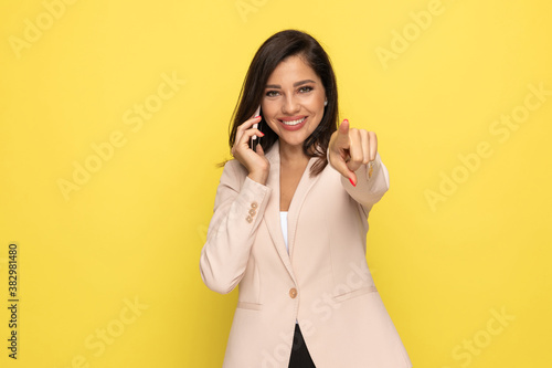 happy young girl in pink suit talking on the phone © Viorel Sima