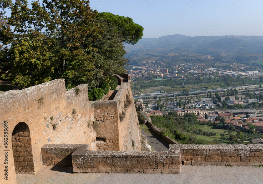 View of the valley from the fortress wall with tower of Orvieto in Umbria, Italy