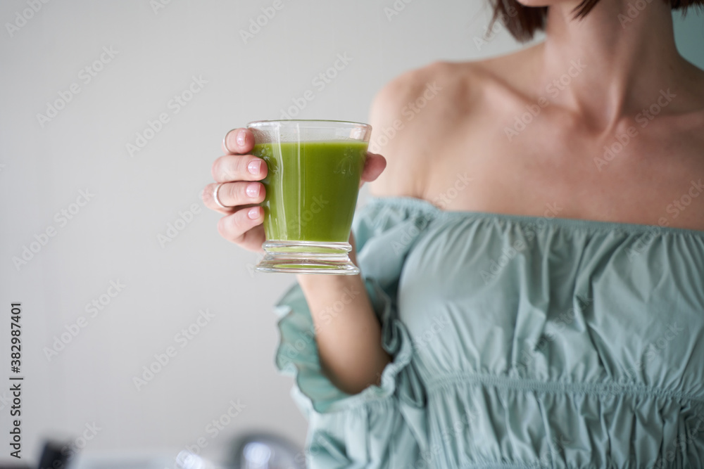 Young pretty lady is holding healthy drink Young pretty lady is holding healthy drink