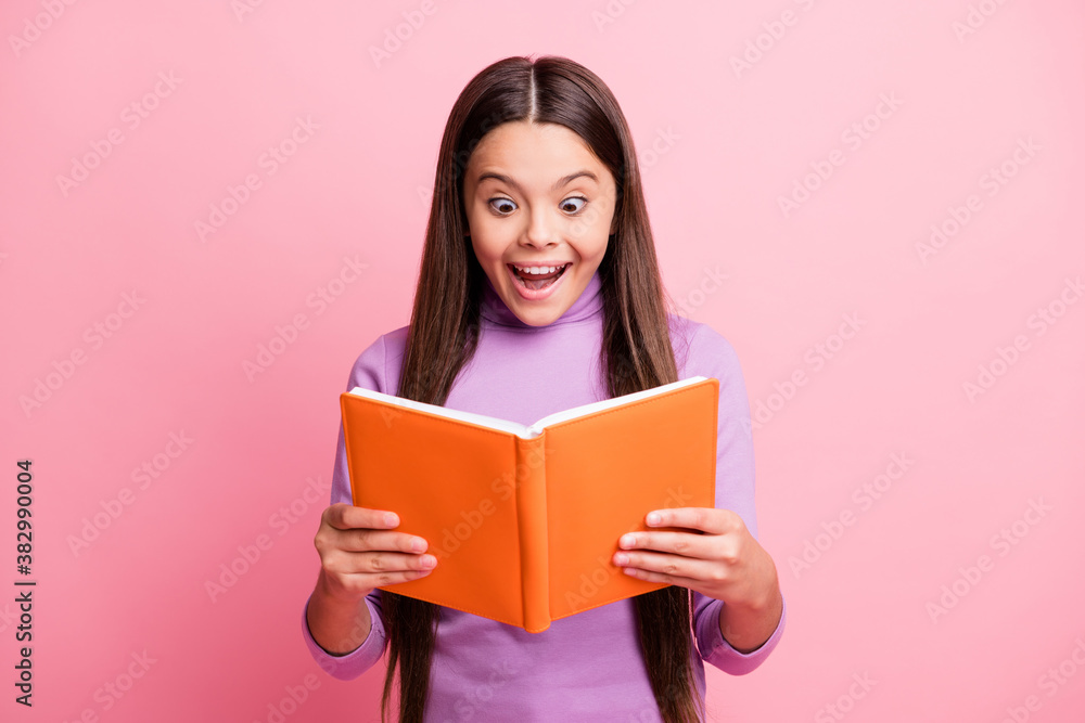 Portrait of her she nice attractive pretty ecstatic amazed cheerful cheery long-haired girl reading interesting academic paper book isolated over pink pastel color background Portrait of her she nice attractive pretty ecstatic amazed cheerful cheery long-haired girl reading interesting academic paper book isolated over pink pastel color background