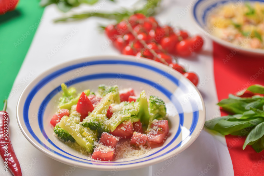 Still life with traditional Italian food on Italian flag. National cuisine concept. Top view, flat lay, menu concept. Still life with traditional Italian food on Italian flag. National cuisine concept. Top view, flat lay, menu concept.
