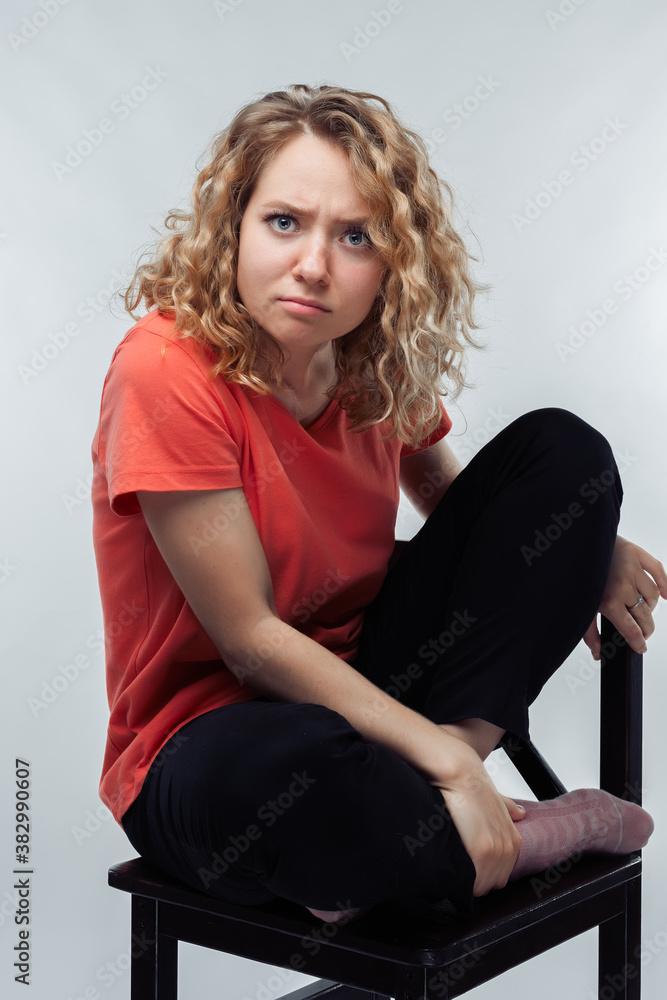 Fototapeta premium Image of nice brooding woman thinking and looking at camera. Human emotions, facial expression concept